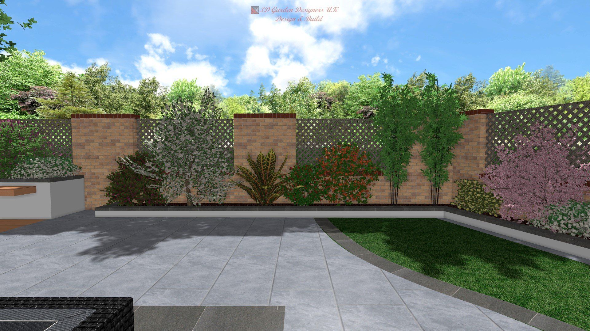 Backyard design with brick wall, greenery, patio, and grass under a blue sky.