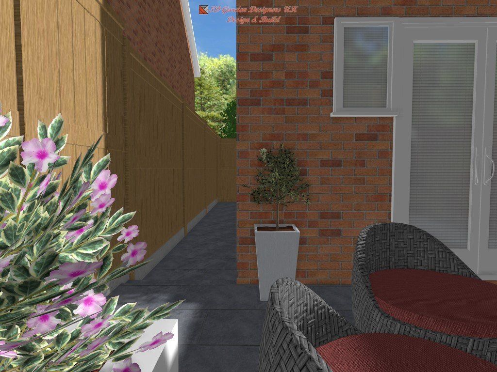 Patio with brick wall, wooden fence, flowers, potted tree, and wicker chairs with red cushions.
