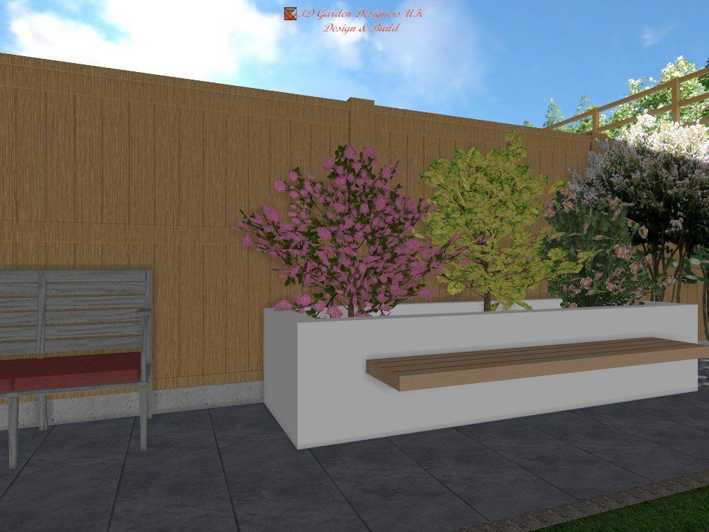 Planter box with flowering shrubs and bench against a wood fence, beside a chair.