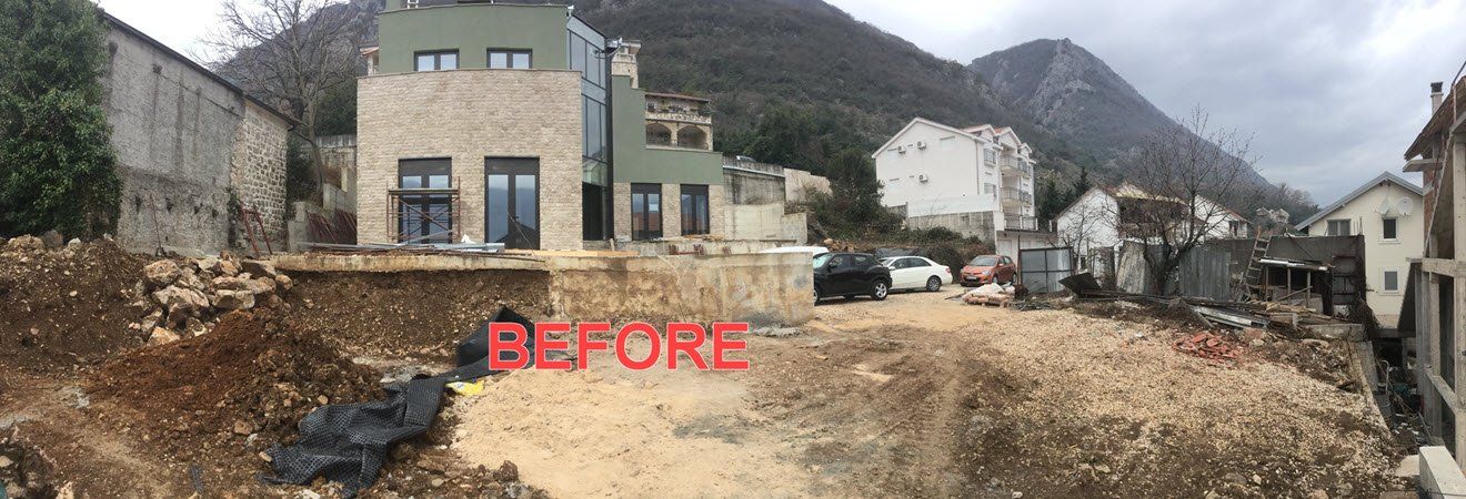 Construction site with a modern house, dirt, and 