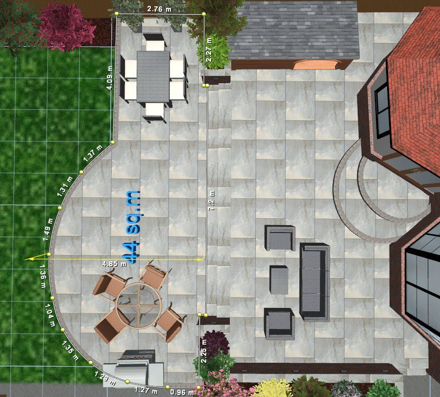 Top-down view of a patio with furniture, landscaping, and a house. The patio has seating areas and is bordered by plants.