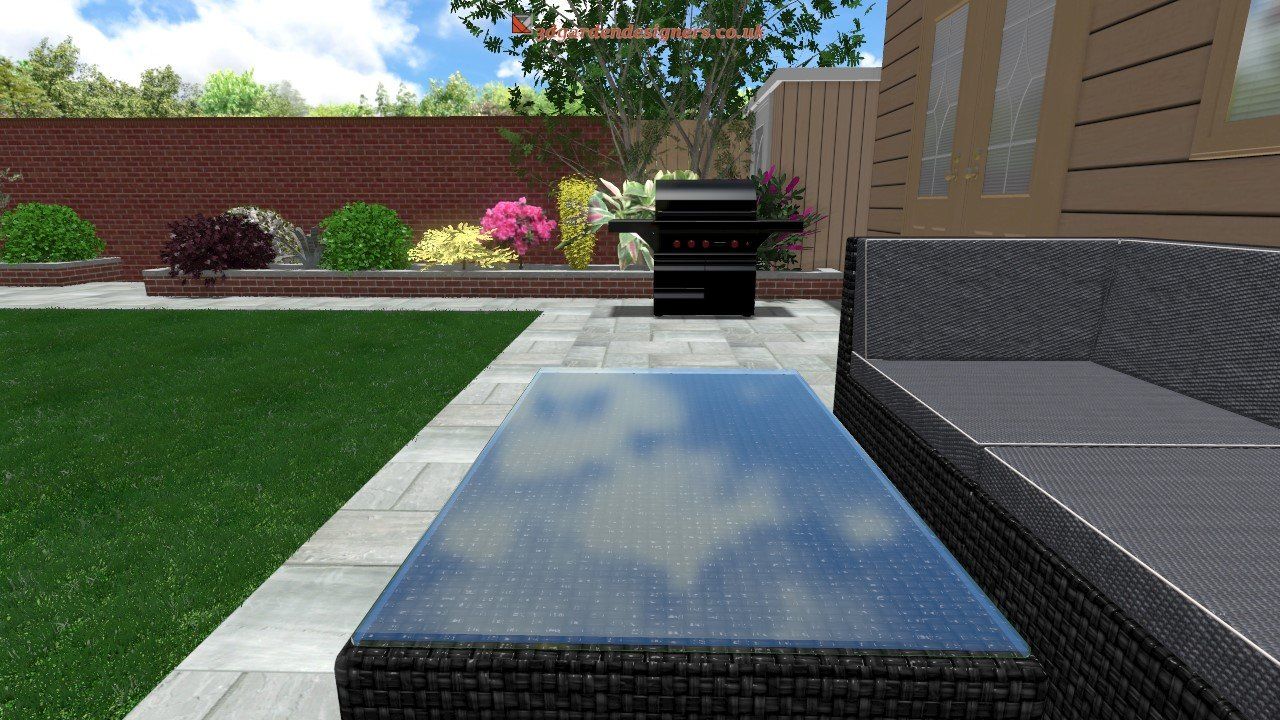Backyard patio with grass, brick wall, outdoor furniture, and a grill.