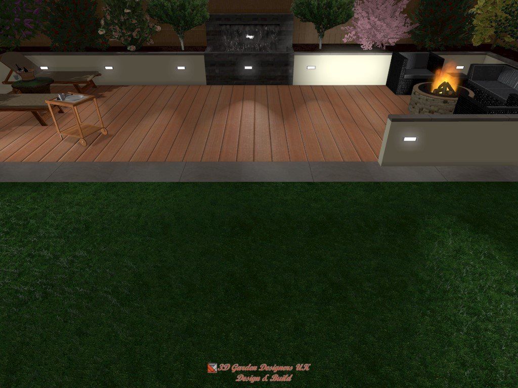 Backyard deck with furniture, small fire pit, and wooden floor with green lawn below.