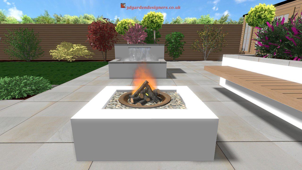A modern outdoor patio with a fire pit, water feature, seating, and landscaping; fire burning.