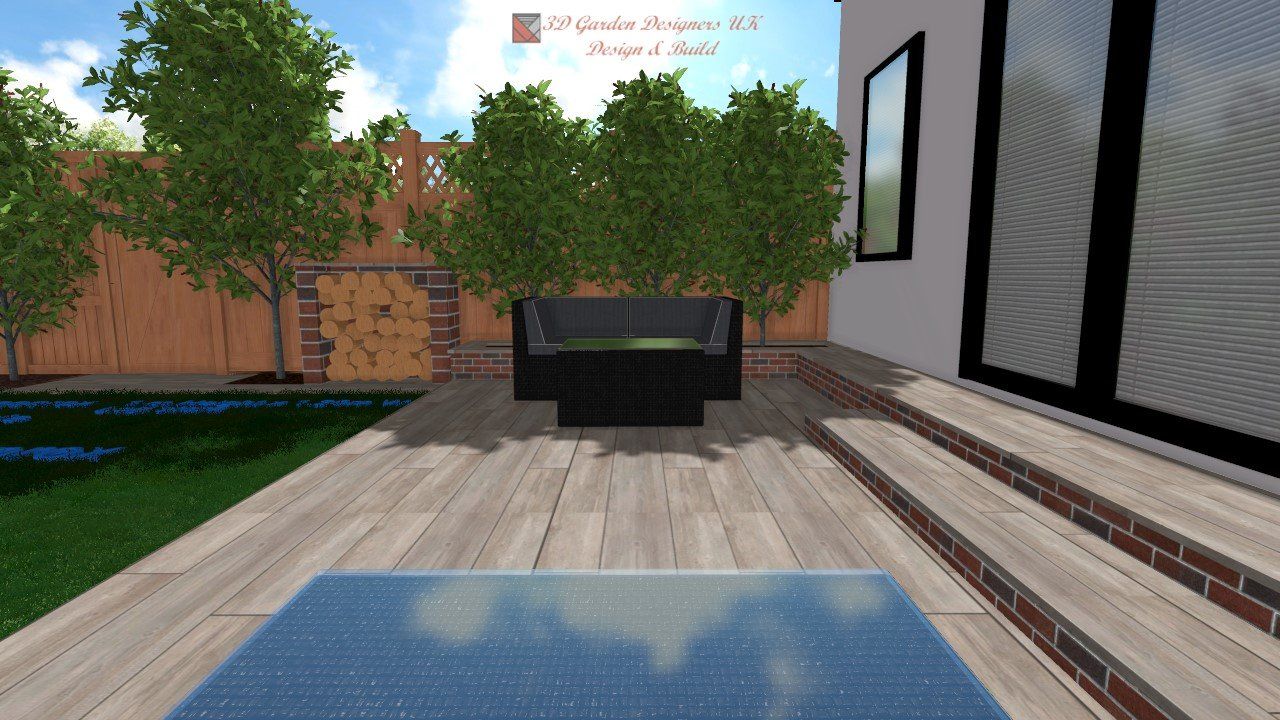 Outdoor patio with a black modern sofa, wooden deck, and a glass-paneled entry.