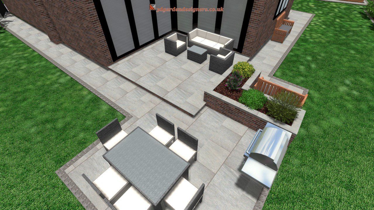 Outdoor patio with seating, grill, and landscaping next to a brick building and green lawn.
