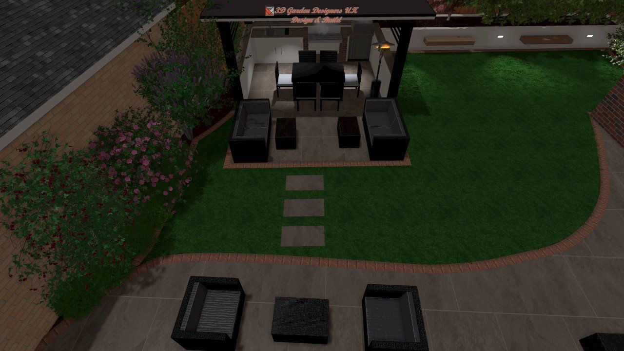 Backyard with patio, lawn, and outdoor kitchen. Black furniture, green grass, and small stone pavers.