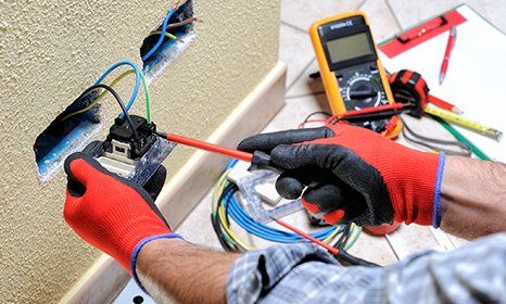 Electrician — Man Working on Electric Circuit in Grants Pass, OR Electrician — Man Working on Electric Circuit in Grants Pass, OR
