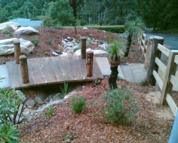 bridge next to wooden fence