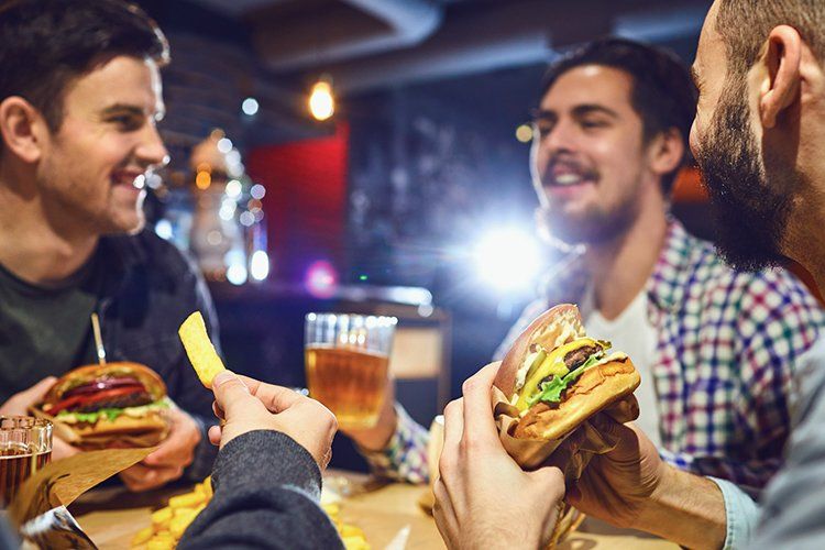 Men Eating Burgers — Chicago, IL — Brehon Pub Men Eating Burgers — Chicago, IL — Brehon Pub