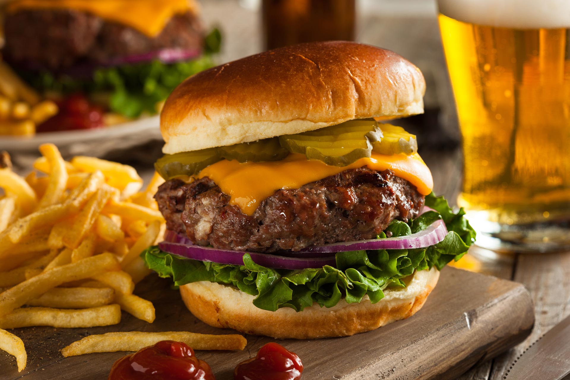 Hamburger with Beer on Wooden Table — Chicago, IL — Brehon Pub Hamburger with Beer on Wooden Table — Chicago, IL — Brehon Pub
