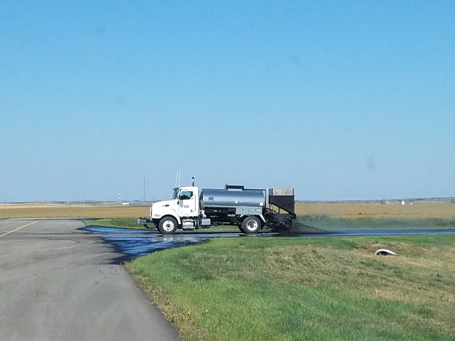 Cape Seals — Truck On The Open Ground in Saint Joseph, MN