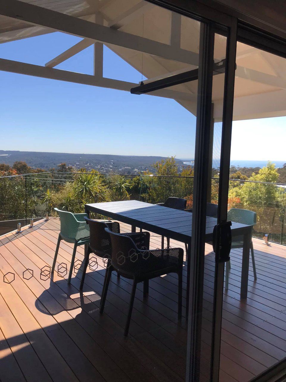 Covered outdoor deck with seating arrangement