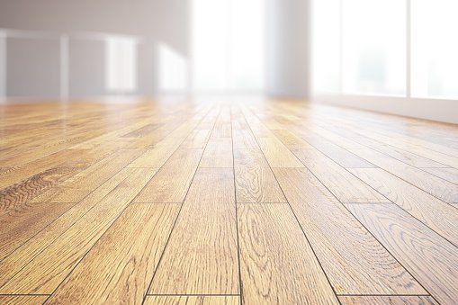 open room with natural light on hardwood flooring