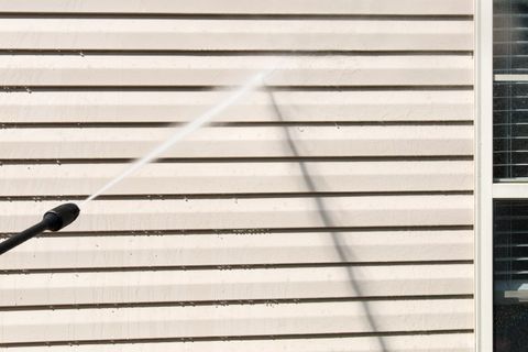 Rug Cleaning — Cleaner Cleaning Vinyl Siding Using Pressure Water in Columbus, GA