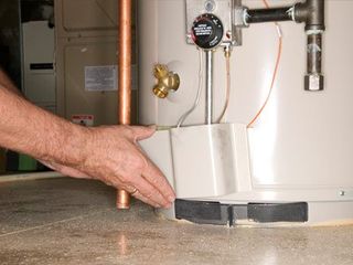 Plumber checking water heater Plumber checking water heater