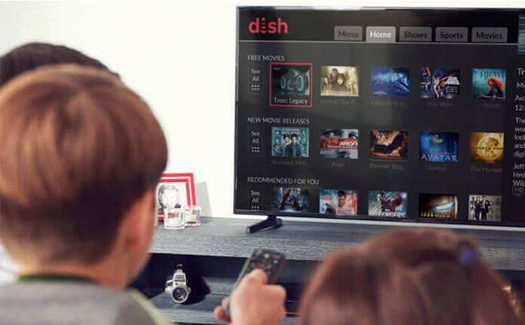 A group of people are watching a dish tv