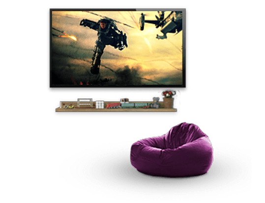 A purple bean bag chair is in front of a flat screen tv