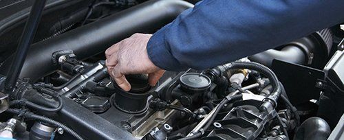 Professional mechanic repairing a vehicle in Edinburgh, EH
