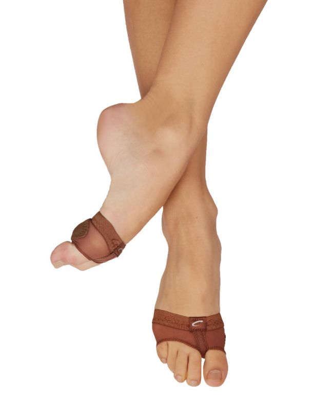 A close up of a woman 's feet wearing sandals