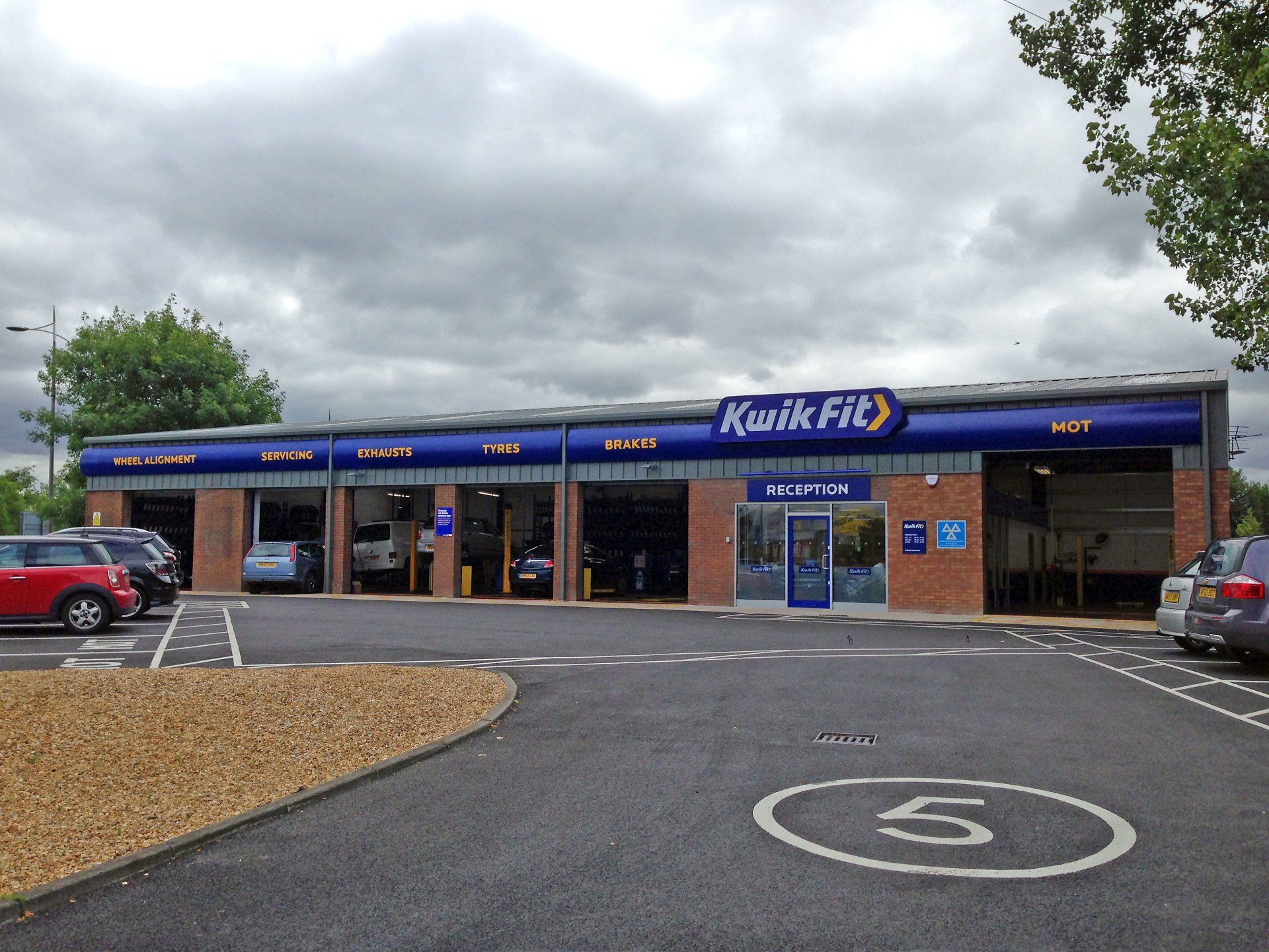 exterior view of automotive repair center including repair bays