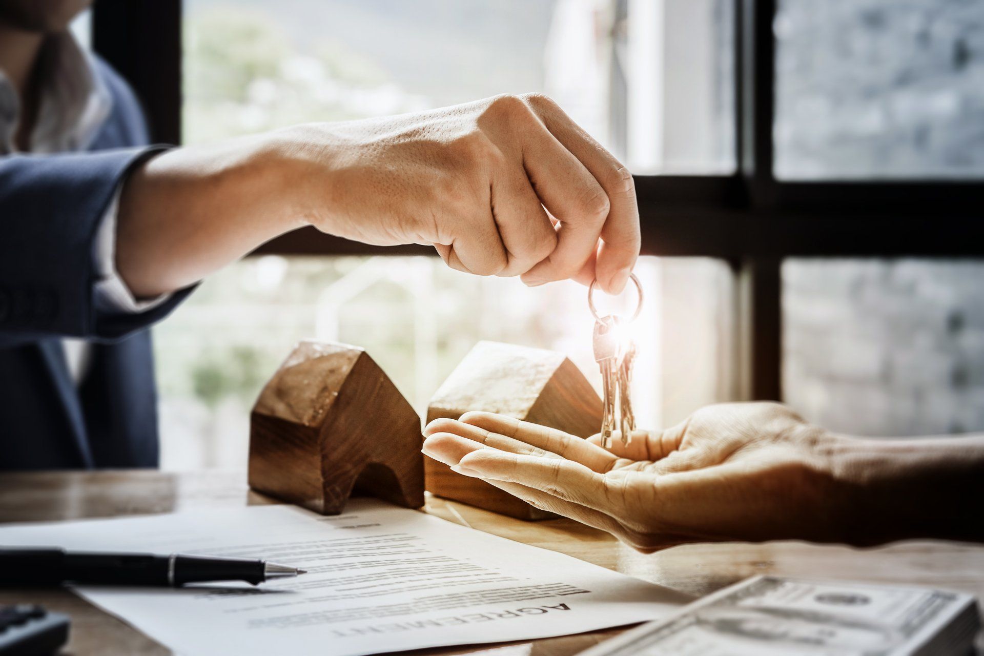 ILITs — Man Giving Keys to a Client in De Pere, WI ILITs — Man Giving Keys to a Client in De Pere, WI