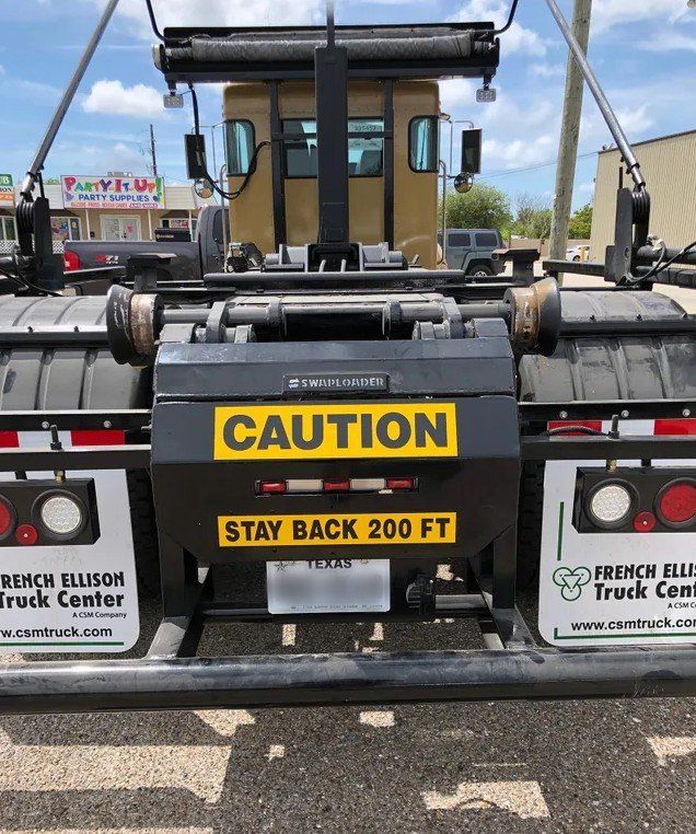Caution Sticker on Truck — Corpus Christi, TX — White Star Services LLC Caution Sticker on Truck — Corpus Christi, TX — White Star Services LLC