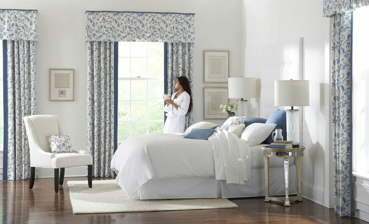 Woman in Bathrobe Looking Out Window of Modern Bedroom in Danbury, CT