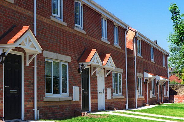 A row of red brick houses.