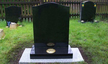 black marble grave stone