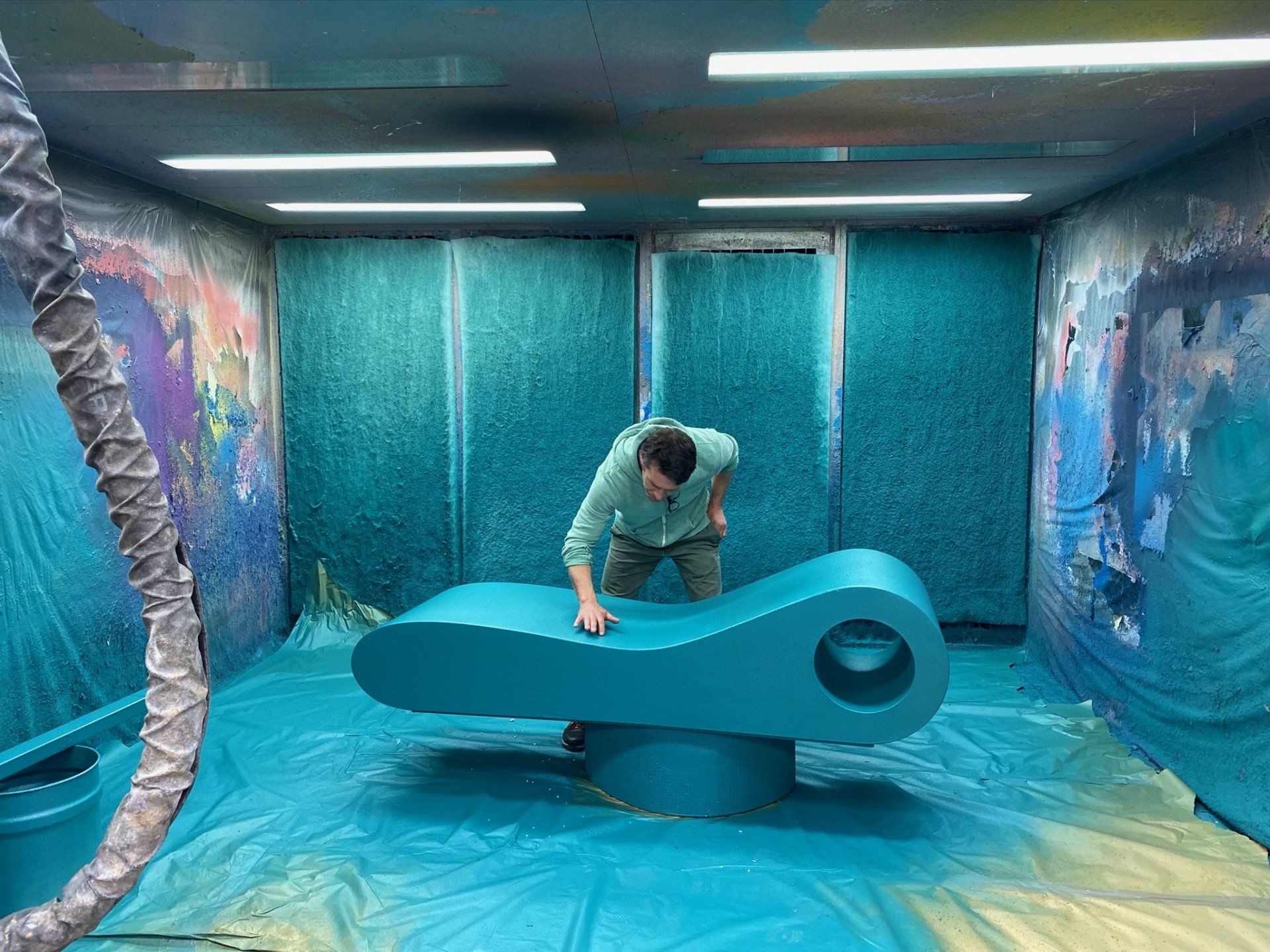 Blue foam furniture being sprayed
