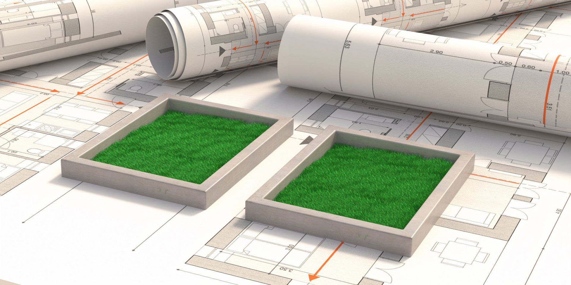Commercial & Industrial Landscape Design — Meridian, MS — Engineering Plus, Inc. Two square planters with green grass sit on architectural blueprints, rolls of blueprints in the background.
