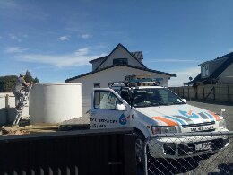 Mr Tank in sunny Hokitika Mr Tank cleaning a concrete water tank