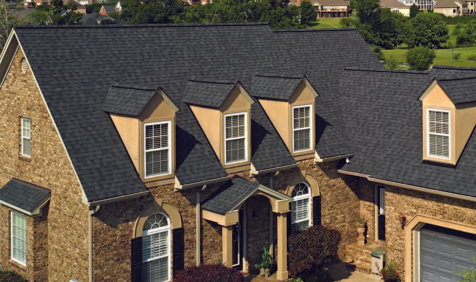 Pro Roofing — Black Shingle Roofs on Large House in Canton, MI Pro Roofing — Black Shingle Roofs on Large House in Canton, MI