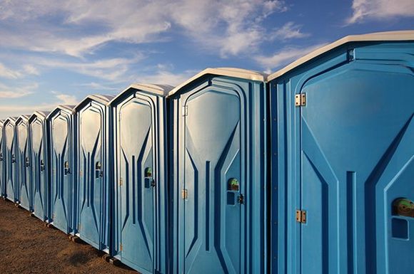 A Line of Several Portable Toilets — Roxboro, NC — Premium Tanks & Stone A Line of Several Portable Toilets — Roxboro, NC — Premium Tanks & Stone