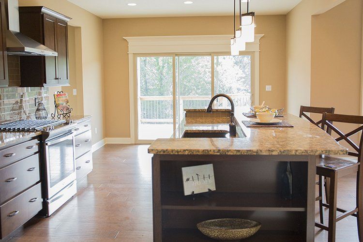 Kitchen Island With Built-in Shelves by Hansman Custom Homes in Mid-MO