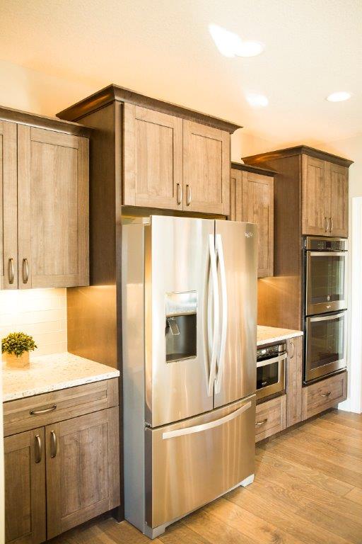 Stainless Steel Fridge & Cabinetry by Hansman Custom Homes in Mid-Missouri