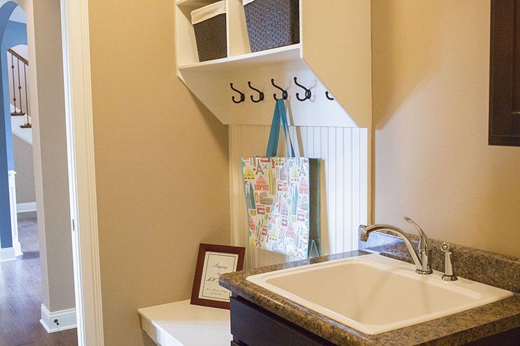Coat Hooks Next to Sink by Hansman Custom Homes in Mid-MO