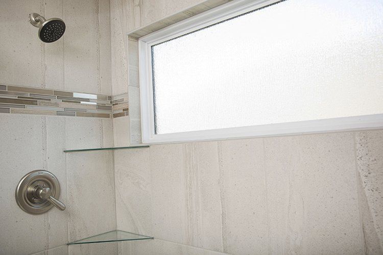 A Shower With a Window Designed by Hansman Custom Homes in Mid-Missouri
