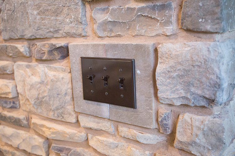 Light Switch on Stone Wall