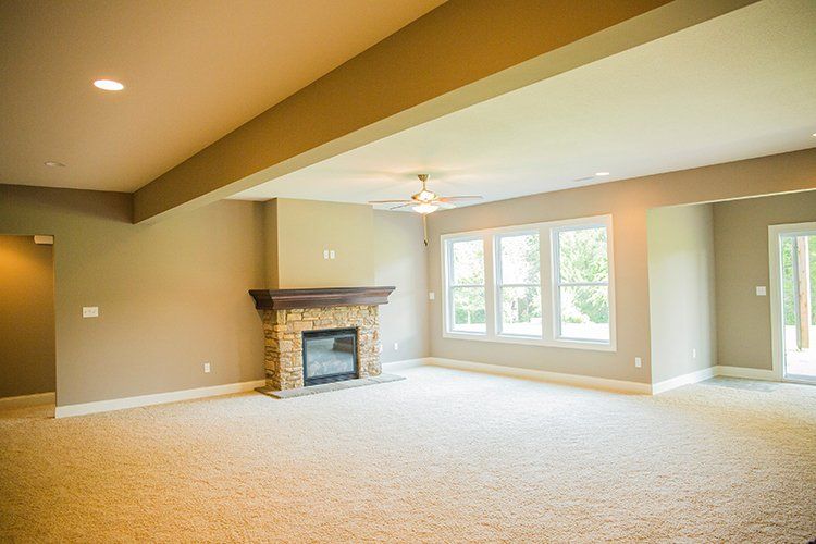 Large Low Ceiling Room With Fireplace by Hansman Custom Homes in Mid-MO