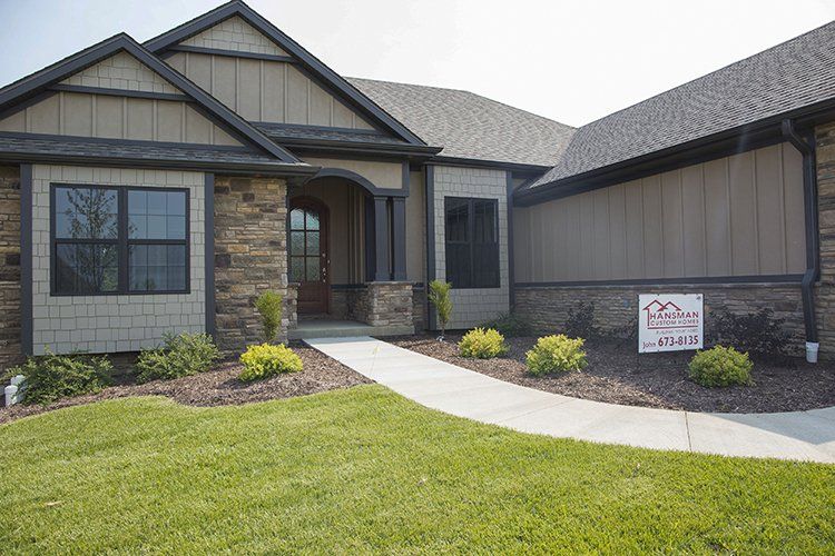 New Mid-MO Home With Hansman Custom Homes Sign Outside
