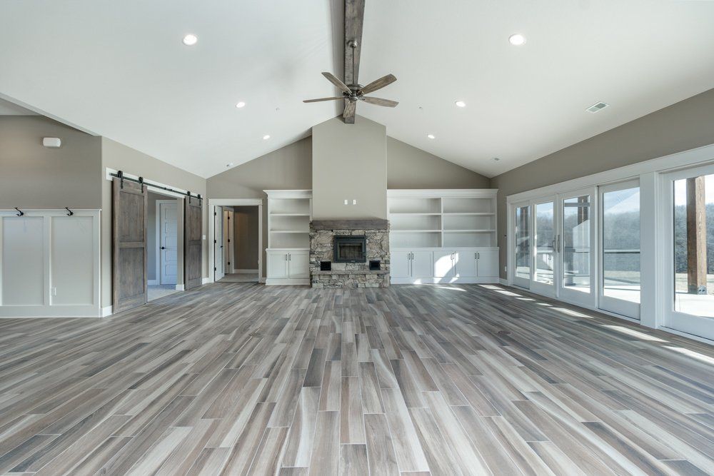 Large Empty Living Room & Windows by Hansman Custom Homes in Mid-Missouri
