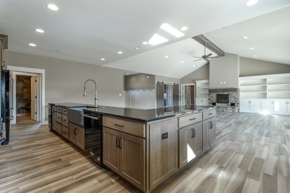 Modern Black & Brown Kitchen by Hansman Custom Homes in Mid-Missouri