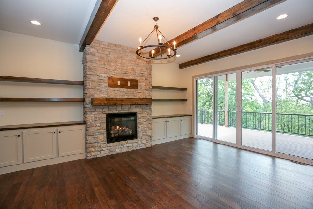 Fireplace Living Area & Balcony by Hansman Custom Homes in Mid-MO