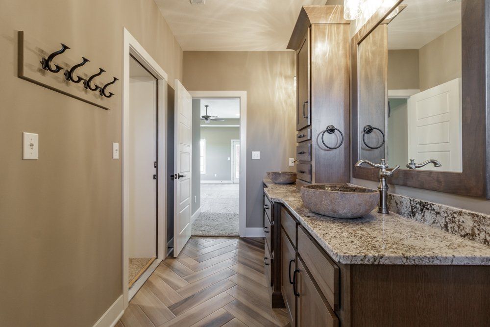 A Custom Bathroom With Built-in Hangers From Hansman Custom Homes in Mid-Missouri