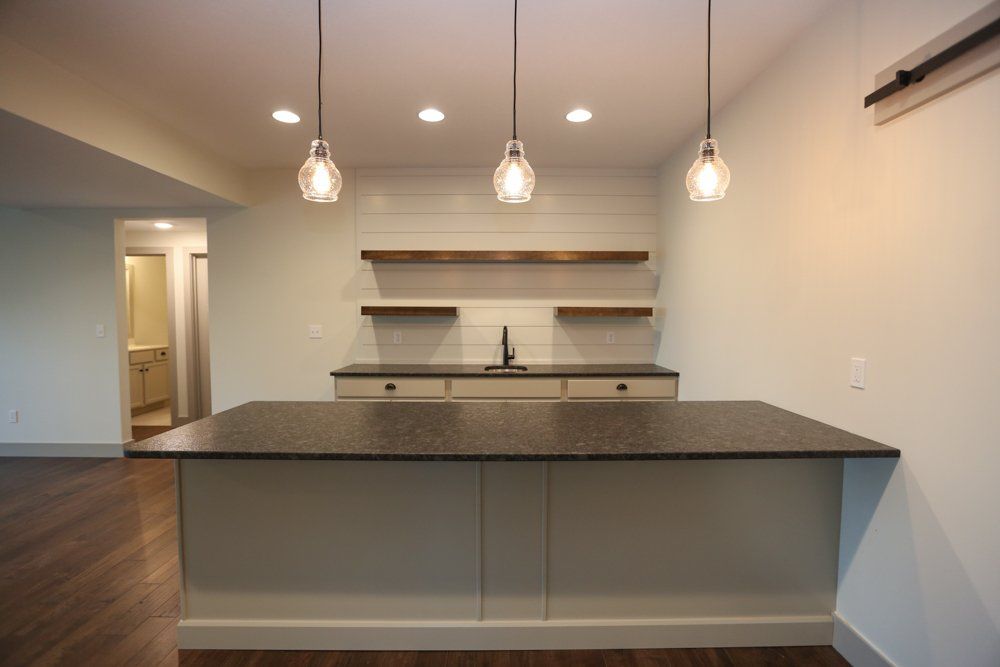 Spacious Modern Home Bar by Hansman Custom Homes in Mid-MO