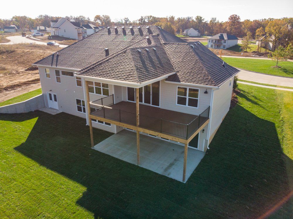Custom Home With Second Floor Balcony by Hansman Custom Homes in Mid-MO