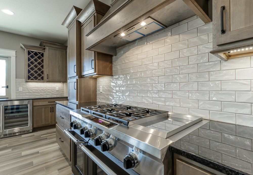 Stainless Steel Oven & Beautiful Backsplash by Hansman Custom Homes