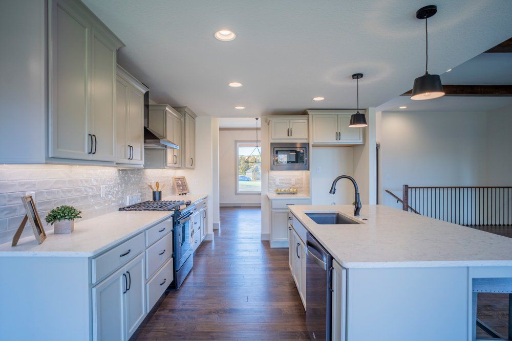 White & Gray Themed Kitchen by Hansman Custom Homes in Mid-Missouri